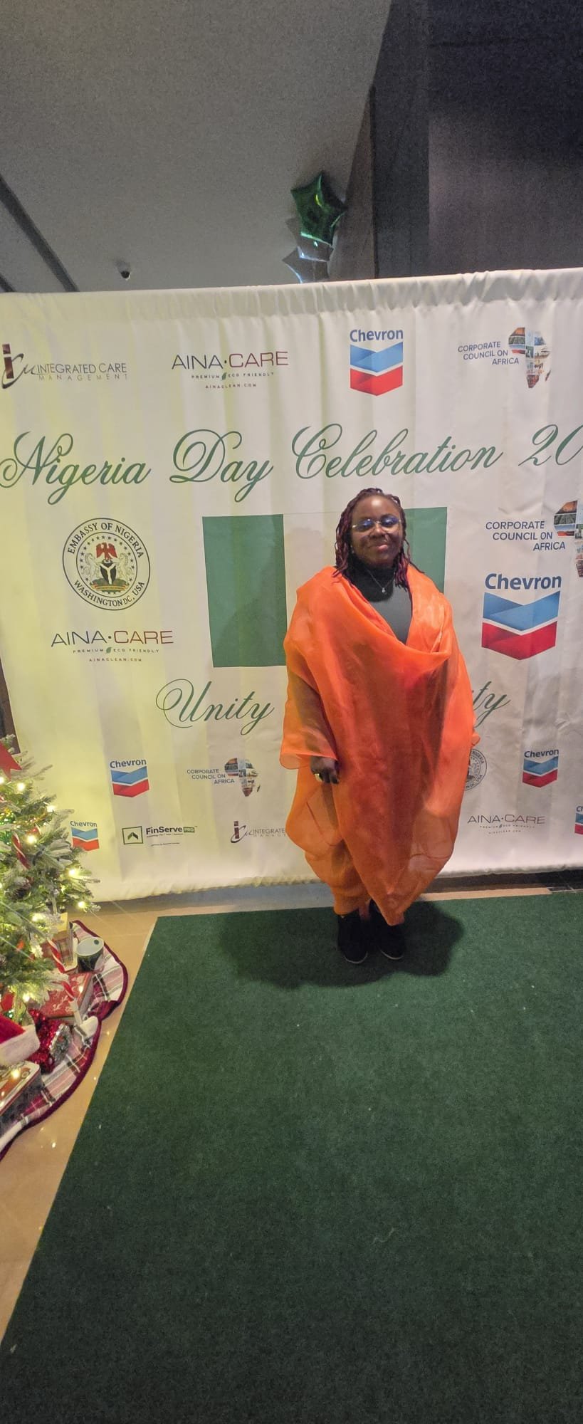 Joy-Jayne Bassey at Nigeria Day Celebration 2025 at the podium with Nigerian and American flags